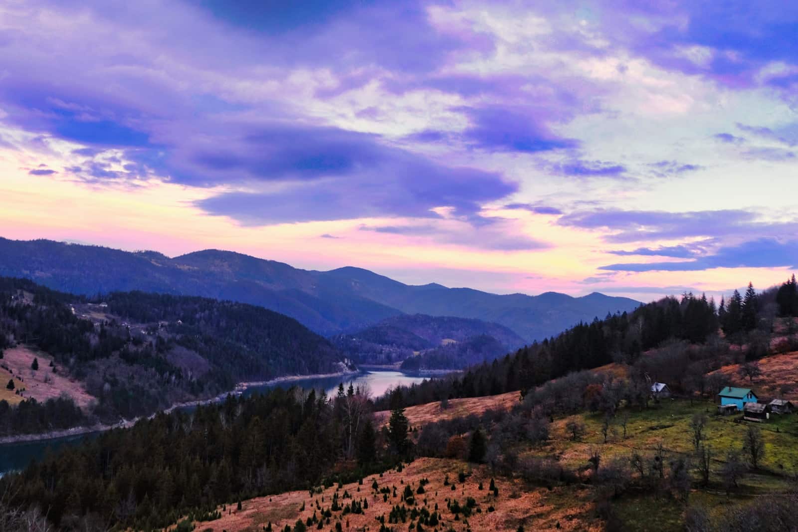 a scenic view of a lake and mountains